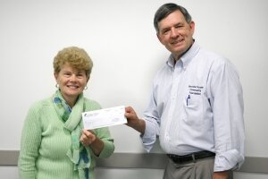 MCCF President Tim Zehr presents Linda Howard with the Remus Area Historical Society with a $500 grant!