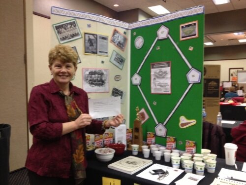 Linda Howard from Remus Historical Society wins for best historical baseball table decoration!